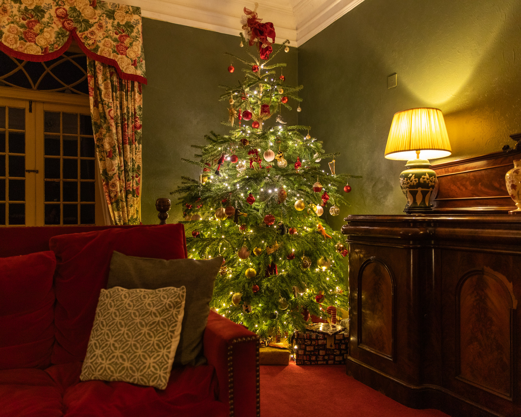 Christmas tree glowing in the Montgomery Manor lounge