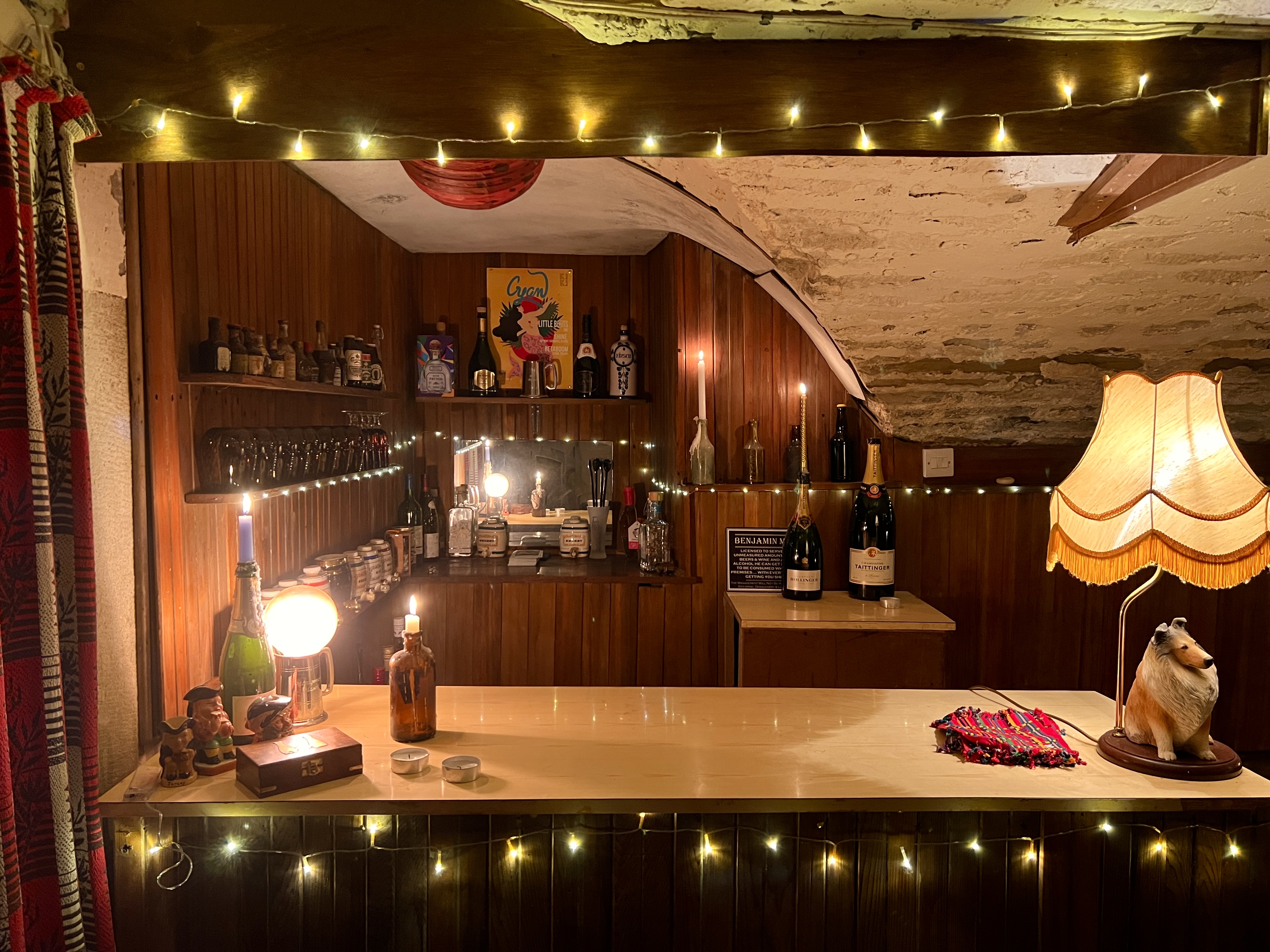 The Cellar Bar at Montgomery Manor with bottles and warm lighting