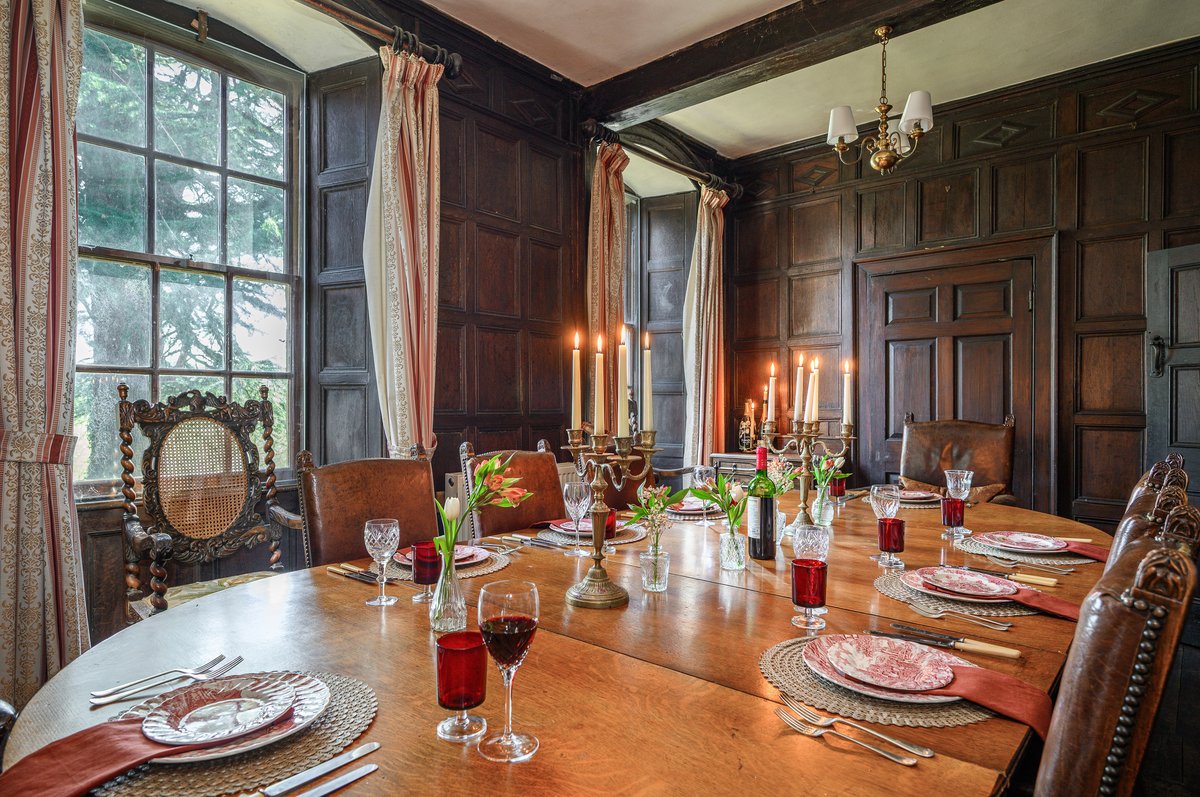 Oak panelled dining room in exclusive-use holiday home