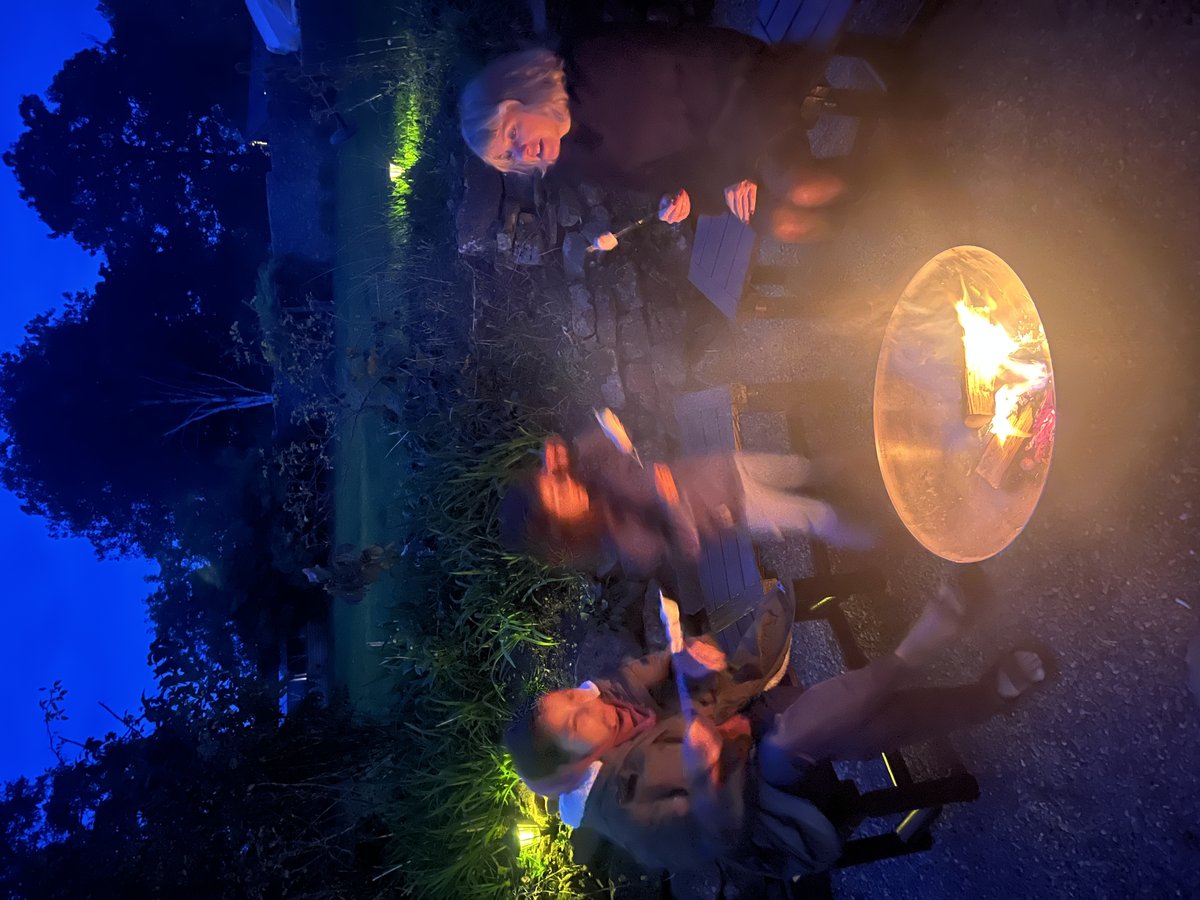 Fire pit area at night in large group accommodation gardens