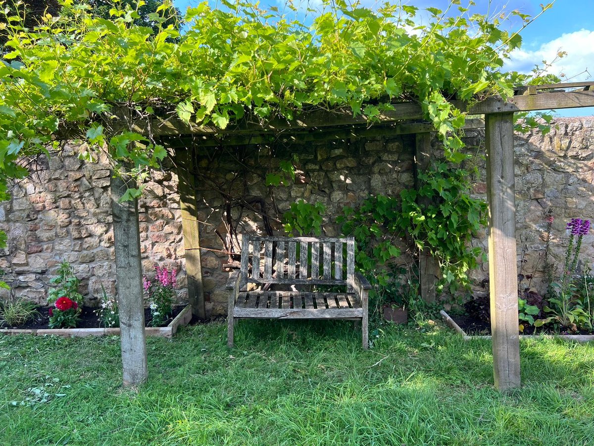 Garden seating in grounds of country house near Symonds Yat