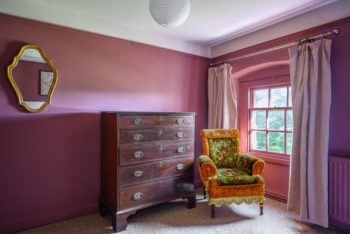 Bold bedroom design in stylish country house accommodation