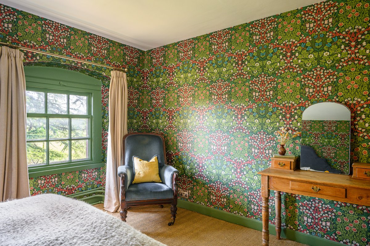 Top floor bedroom in historic house with gardens